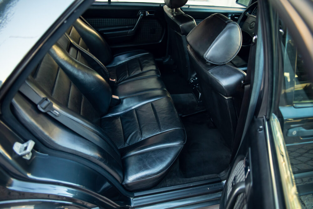 Vintage car interior with black leather seats