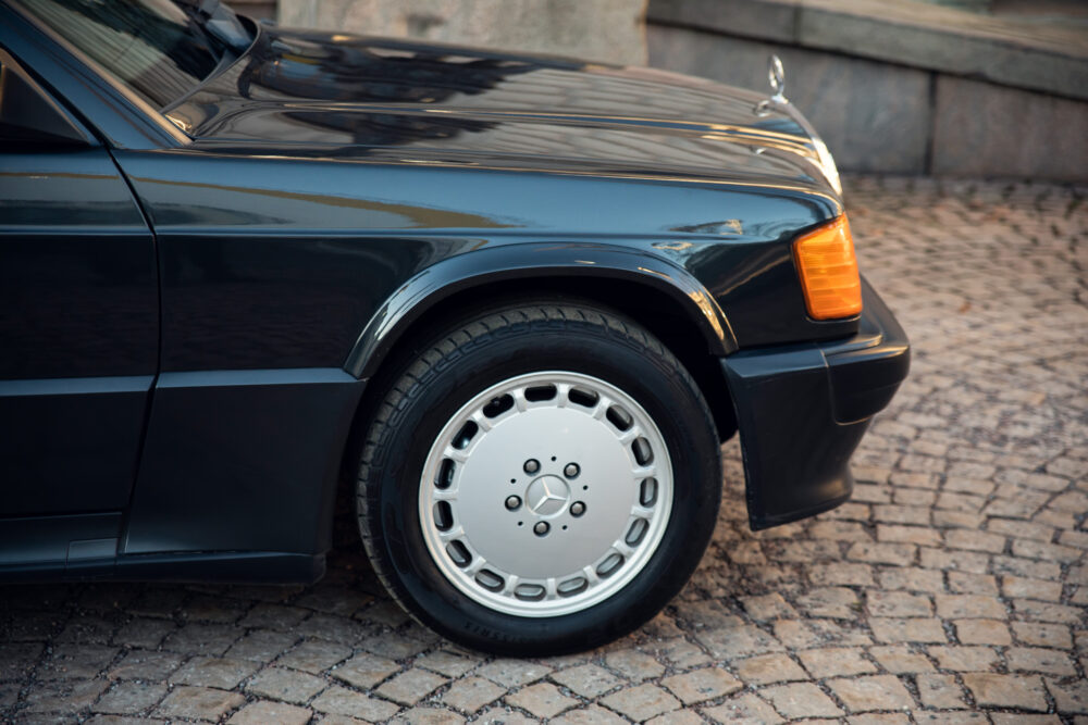 Black vintage Mercedes car on cobblestone street