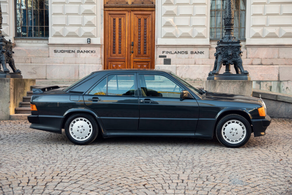 Vintage black sedan parked outside Finland's Bank building