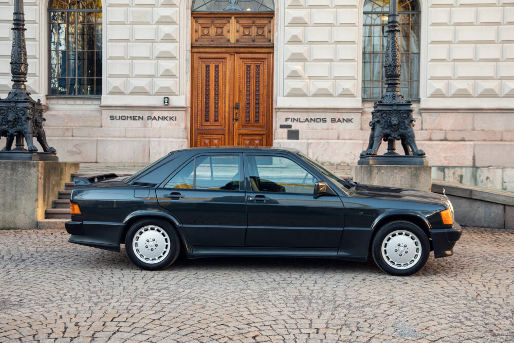 Vintage black sedan parked outside Finland's Bank.