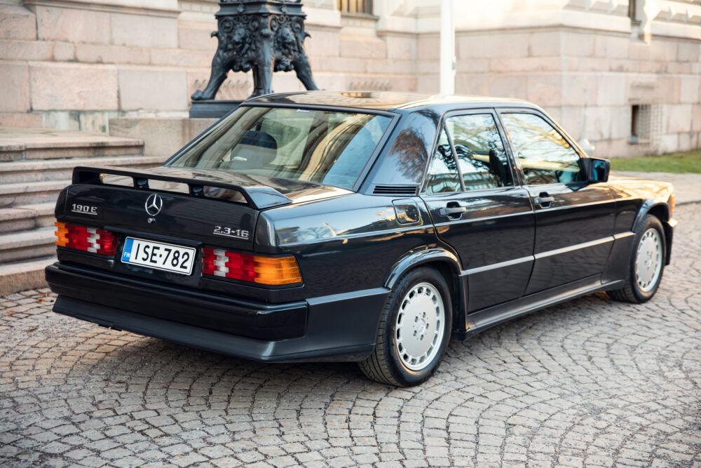 Vintage Mercedes 190E parked in historic area