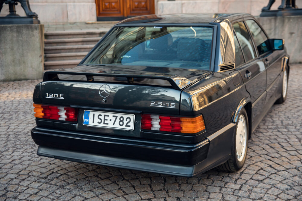 Vintage Mercedes 190E parked near stone steps