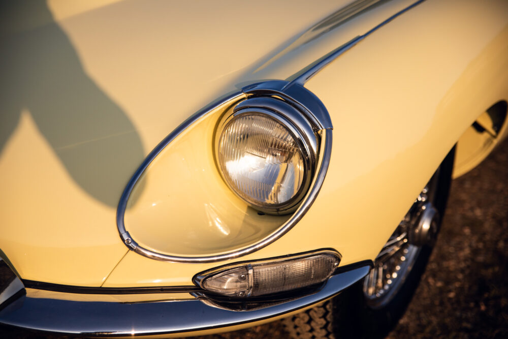 Close-up of vintage yellow car headlight