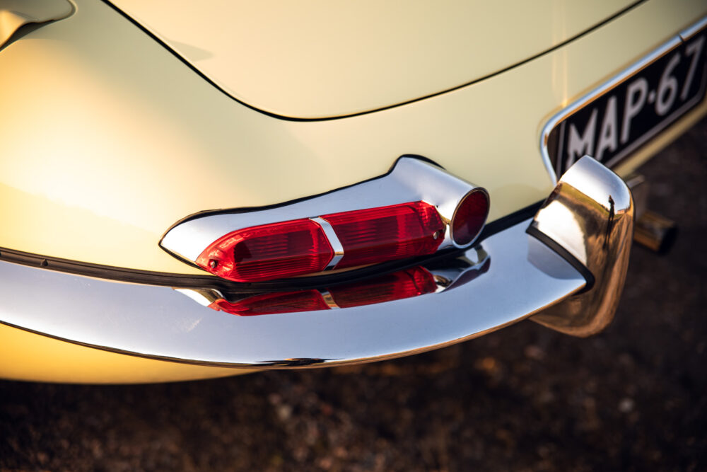 Vintage car tail lights and chrome bumper close-up