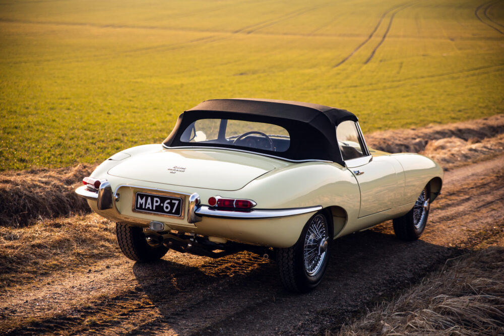 Vintage cream convertible car in countryside