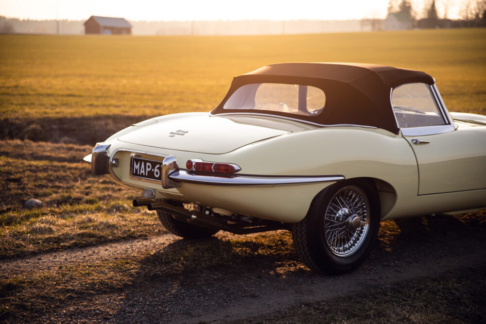 Vintage convertible car in sunset field