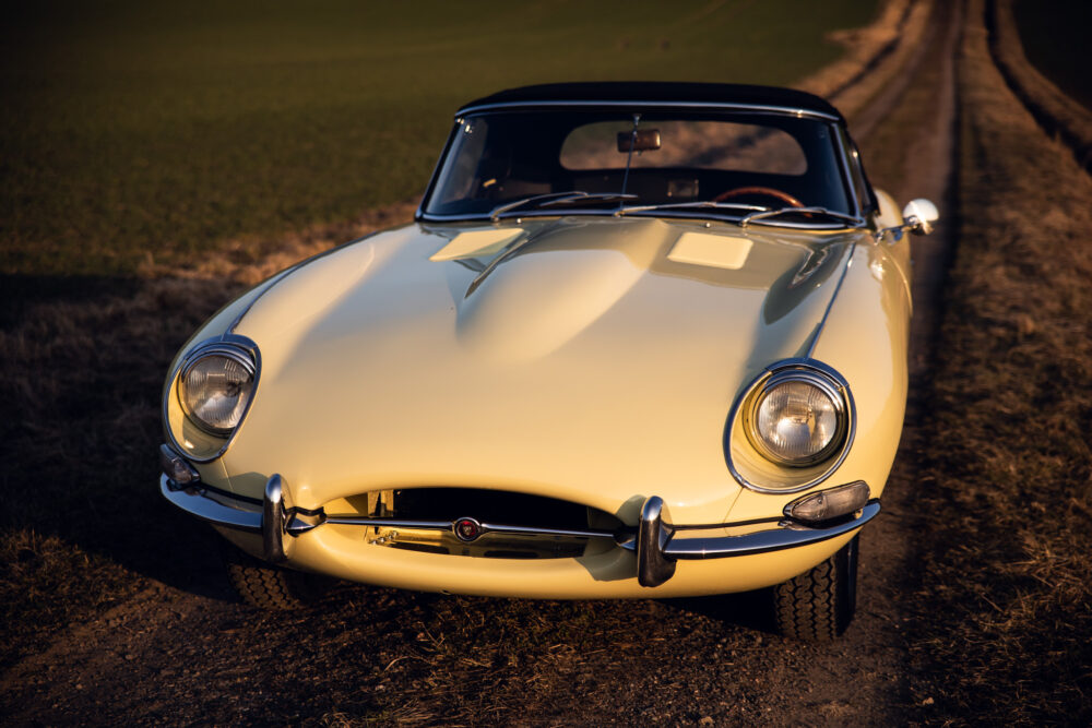 Vintage yellow sports car on a countryside road