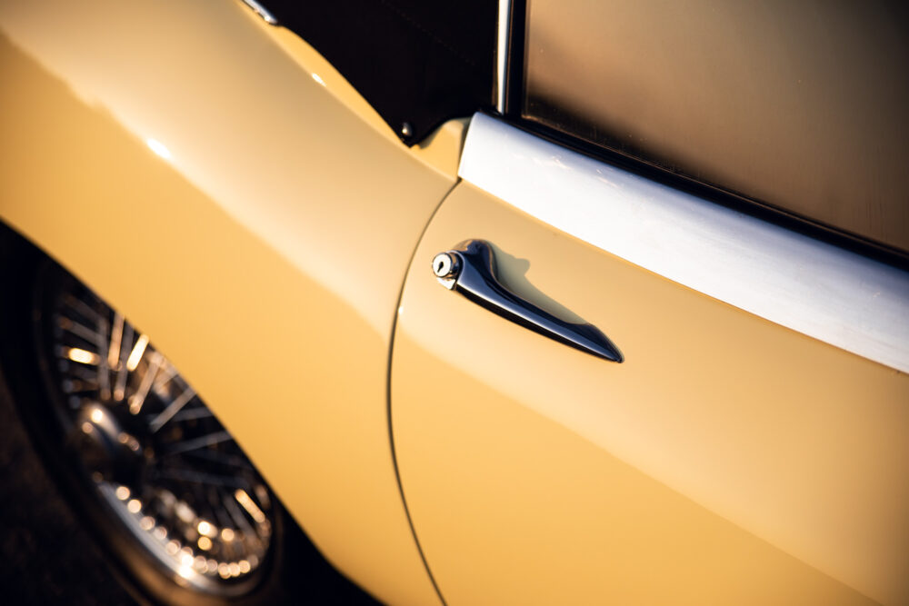 Vintage yellow car door and chrome handle