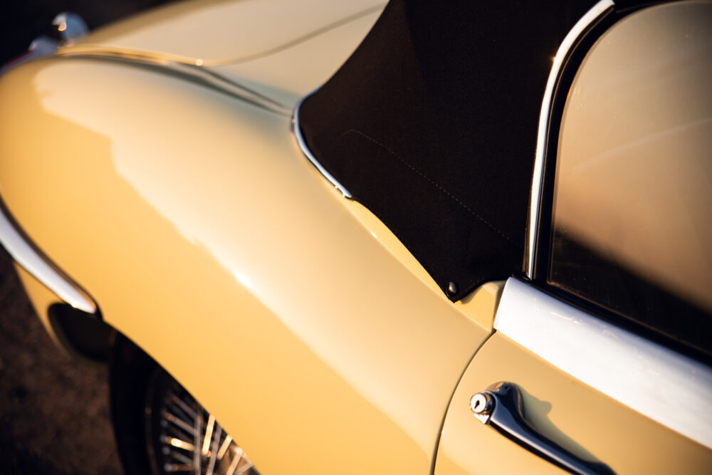 Vintage cream convertible car at sunset