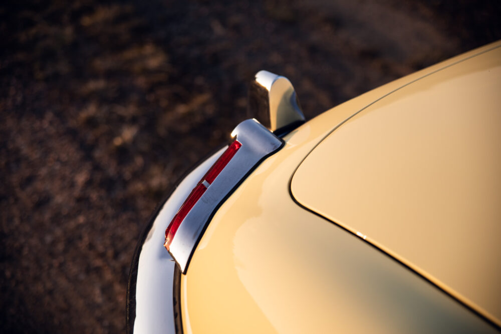 Close-up of classic car's tail fin and light