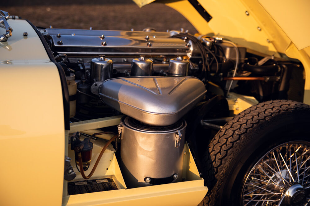 Close-up of vintage car's engine and front wheel