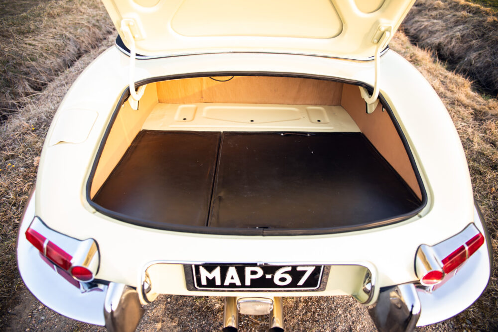 Vintage beige car open trunk interior view