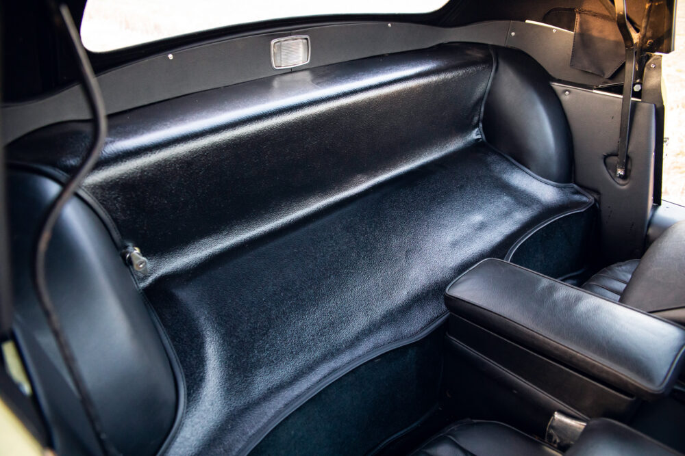 Classic car's sleek black leather backseat interior
