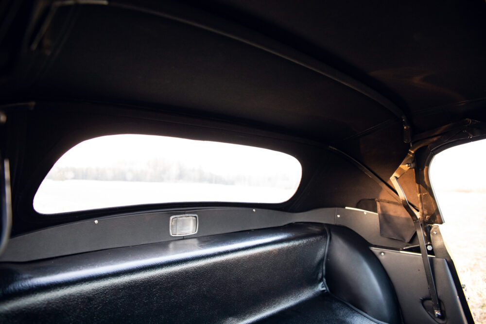 Interior view from classic car looking at snowy field