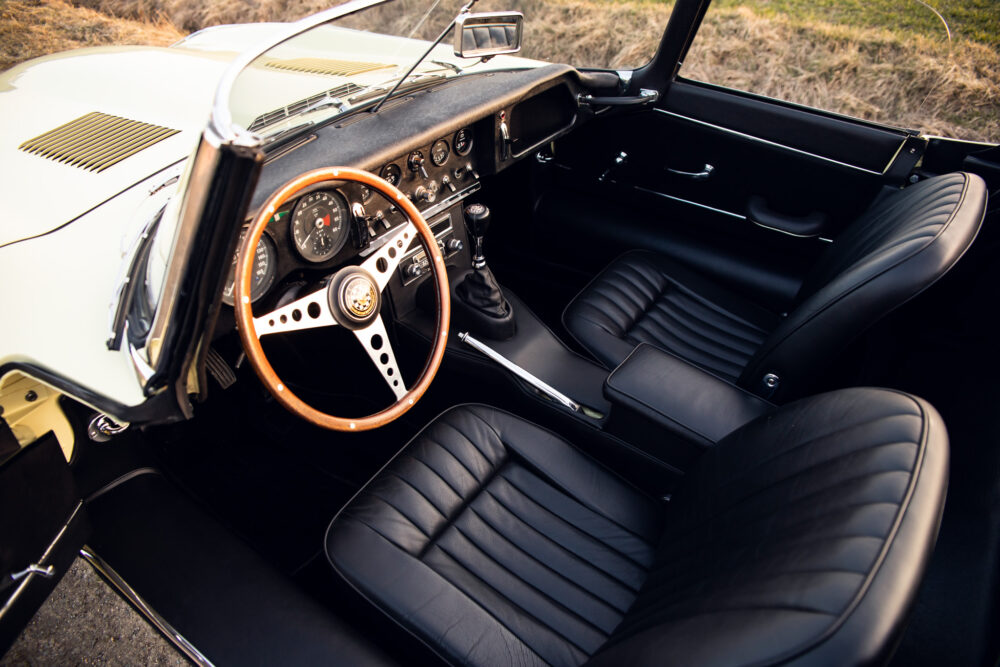 Vintage car interior with wooden steering wheel