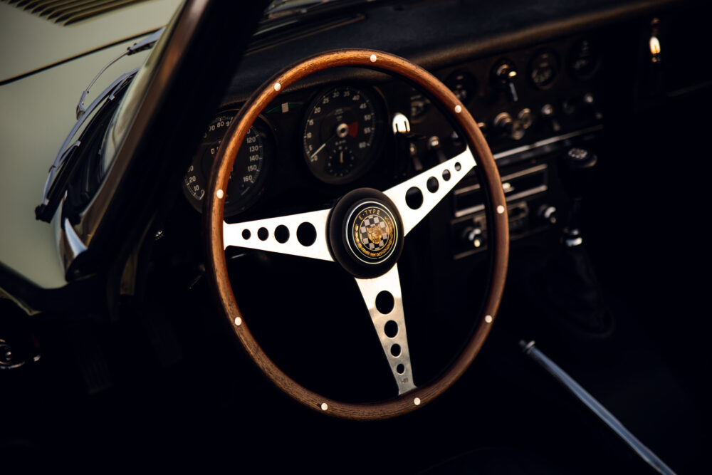 Vintage car steering wheel and dashboard