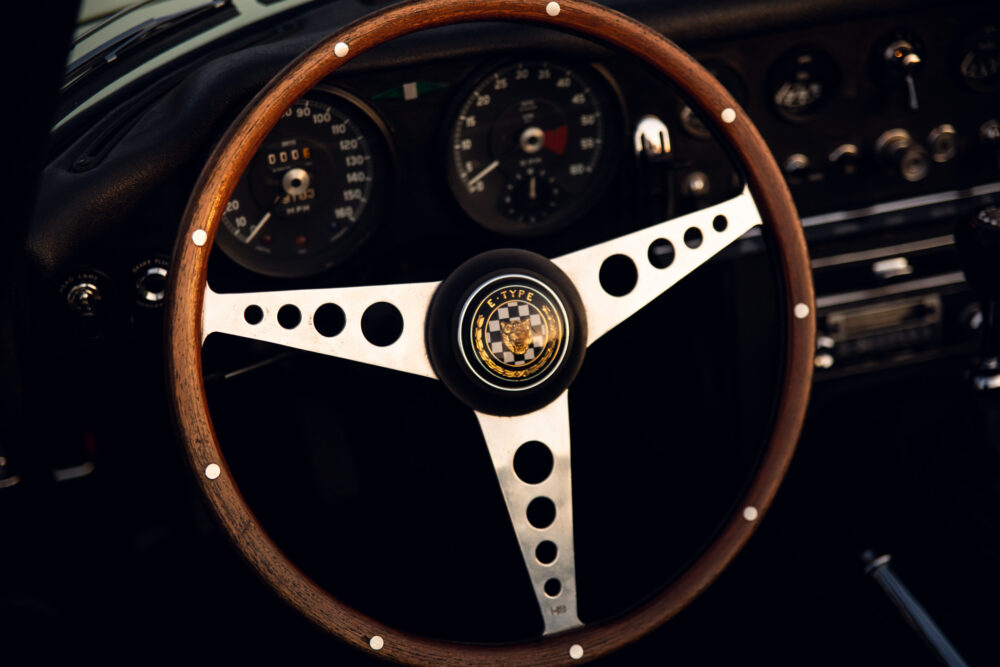 Vintage E-Type steering wheel and dashboard close-up