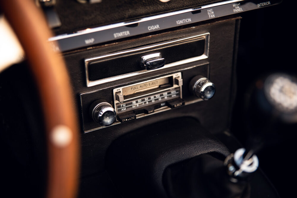Vintage car dashboard with classic radio and switches