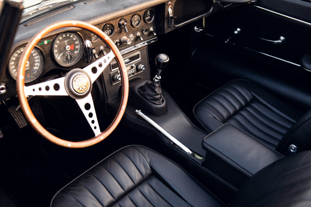 Vintage car interior with wooden steering wheel