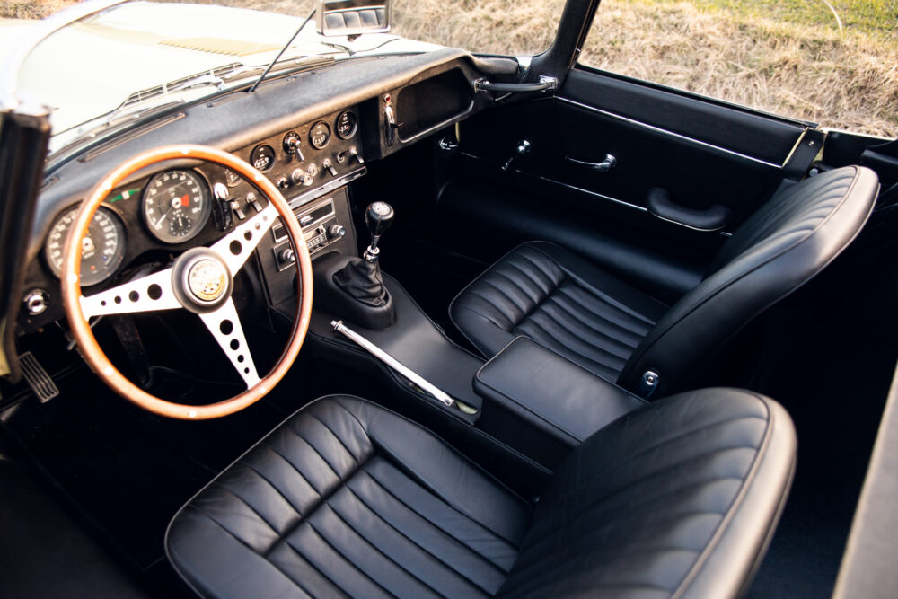 Vintage car interior with wooden steering wheel