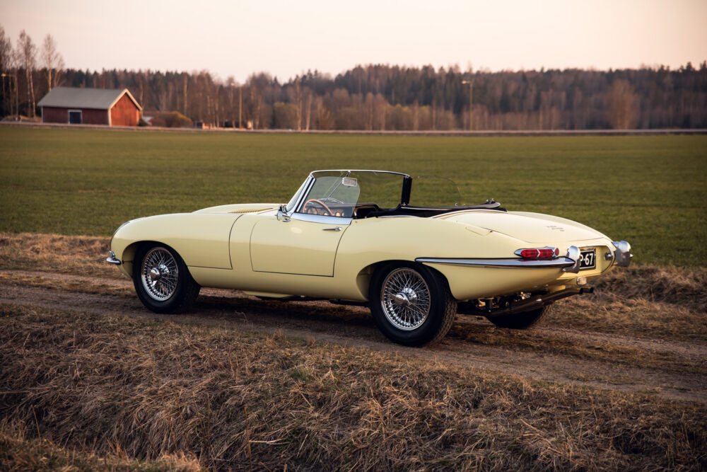 Vintage yellow convertible car in countryside field