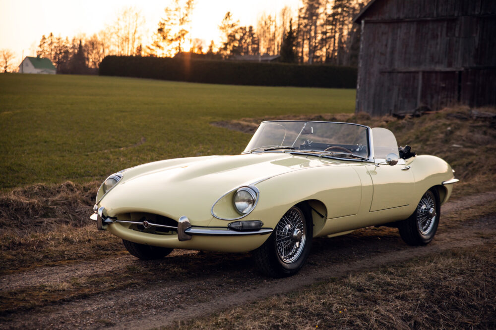 Vintage yellow convertible car parked at sunset