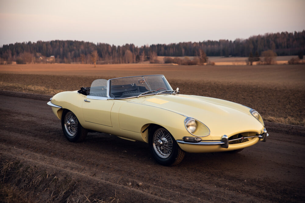 Vintage yellow convertible car on rural road