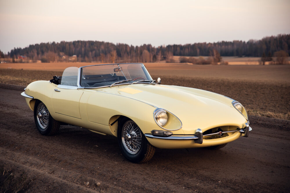 Vintage yellow convertible car on rural road