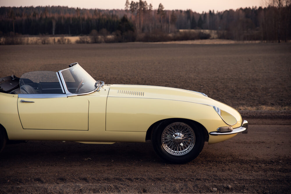 Vintage yellow convertible car in rural setting