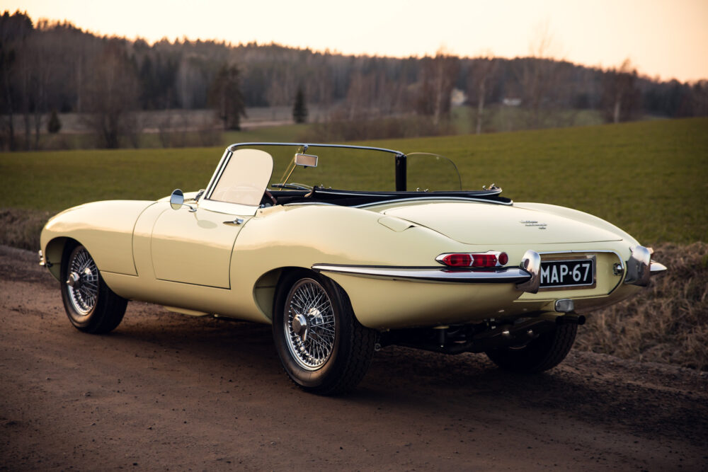 Vintage yellow convertible car in countryside at sunset