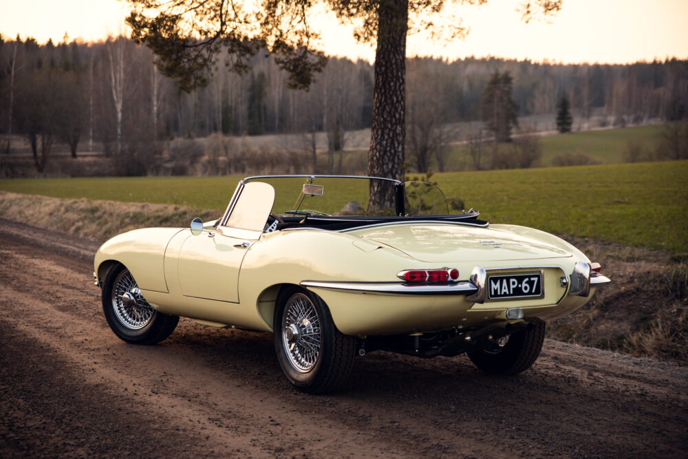 Vintage yellow convertible car parked beside rural road