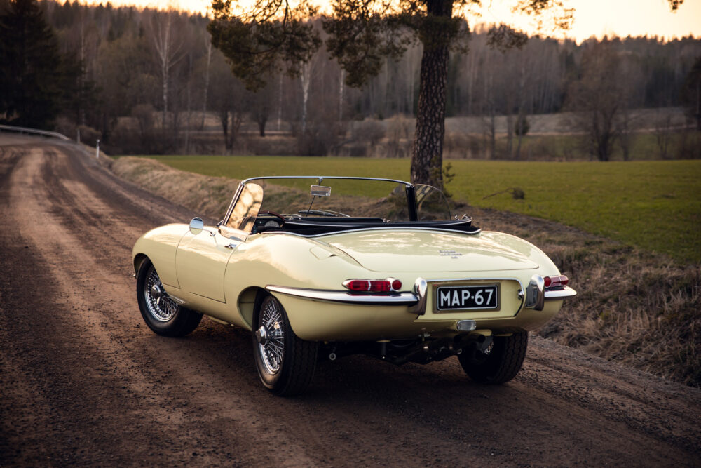 Vintage yellow convertible car on countryside road