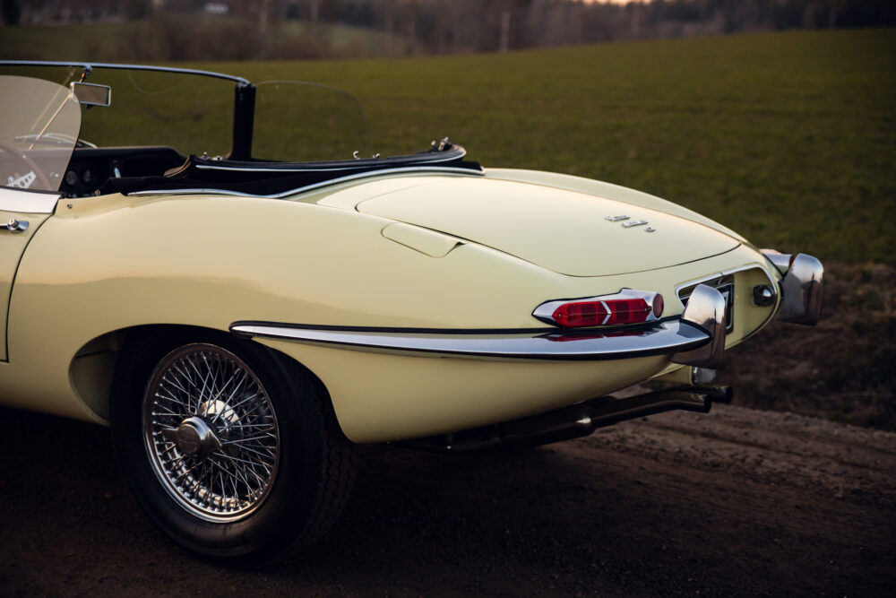 Vintage yellow convertible car on rural road