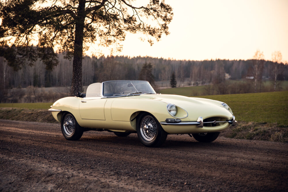 Vintage yellow convertible car on rural road