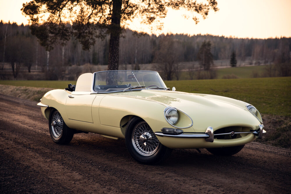 Vintage yellow convertible car parked in countryside