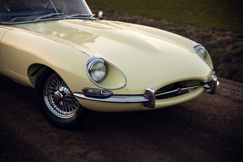 Vintage yellow sports car on dirt road