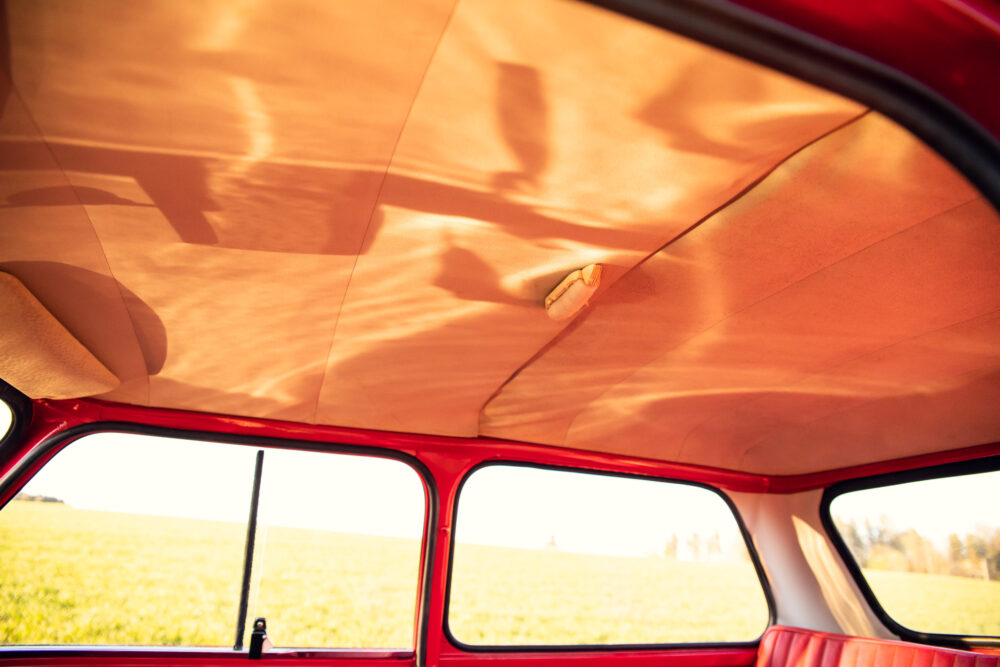 Interior view of vintage car with red upholstery