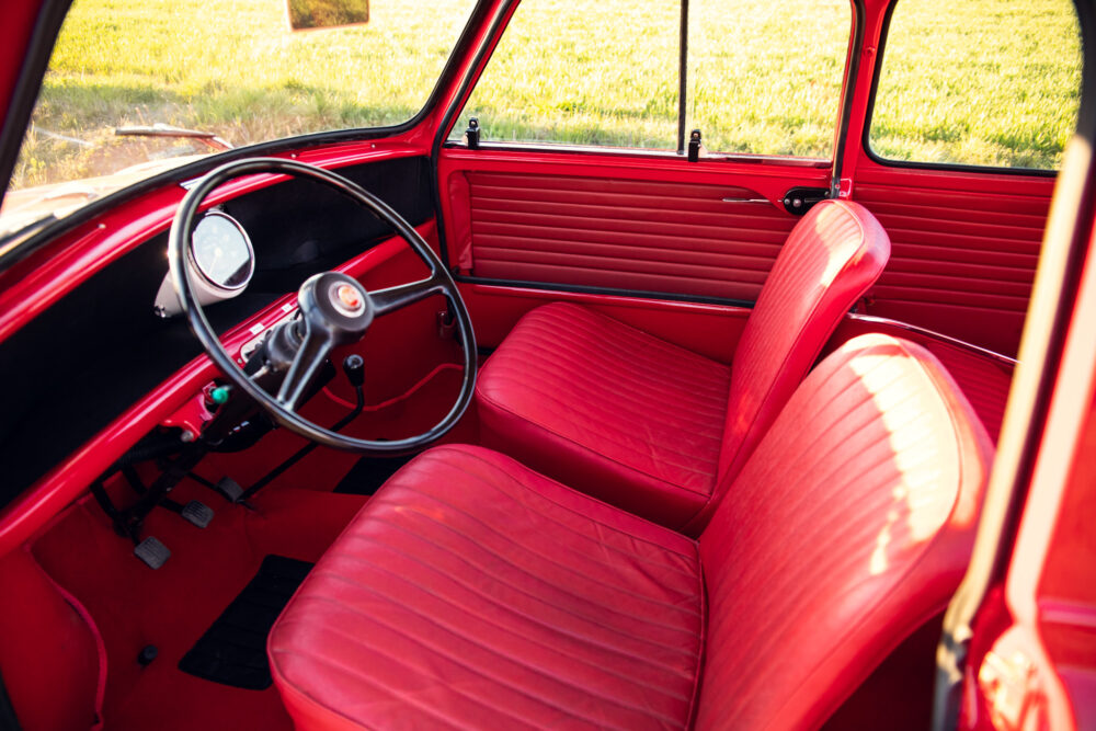Vintage red car interior with steering wheel