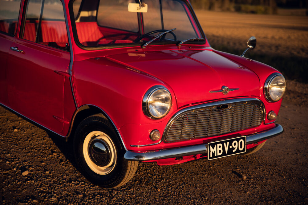 Vintage red Mini Cooper at sunset
