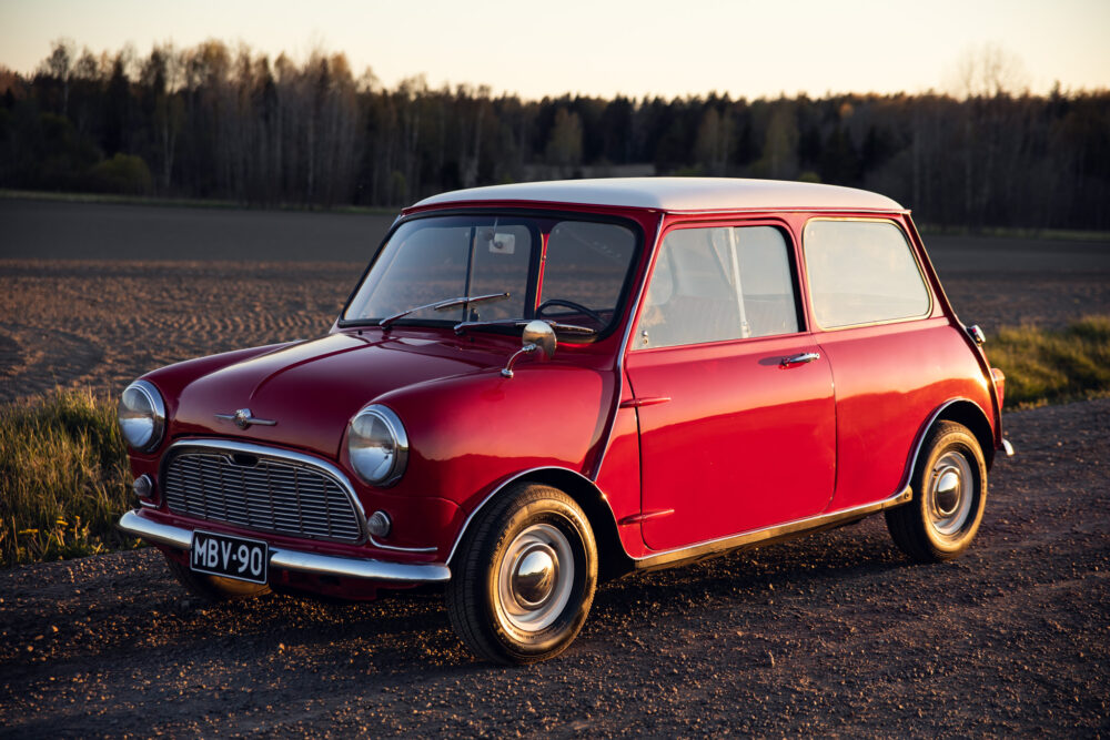 Vintage red Mini Cooper parked in rural setting