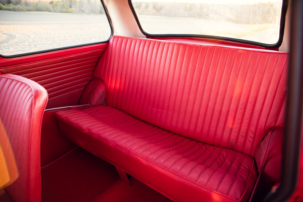 Bright red vintage car interior with sleek seats