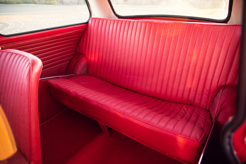 Red vintage car interior with classic bench seat