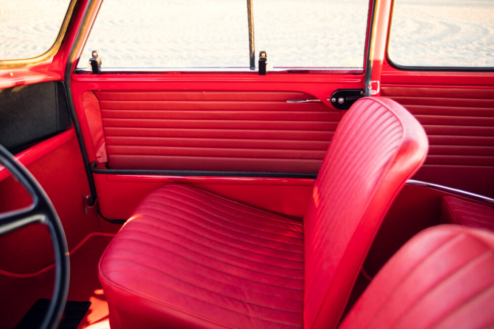 Vintage red car interior with stylish seats and door