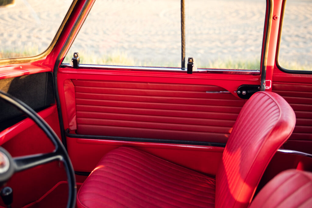 Vintage red car interior with stylish seats and door