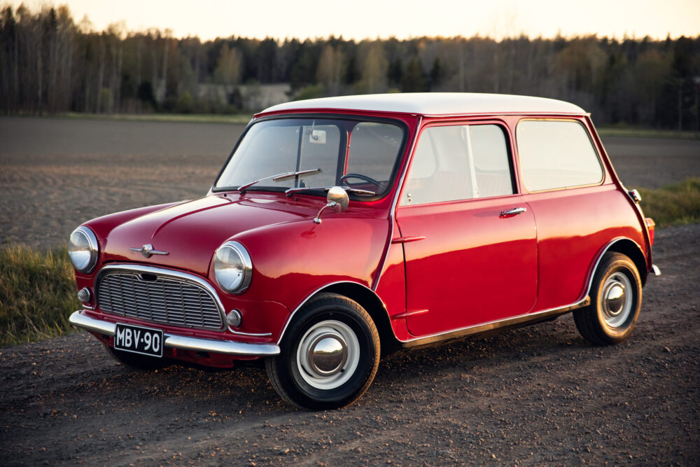 Vintage red Mini Cooper parked in rural area
