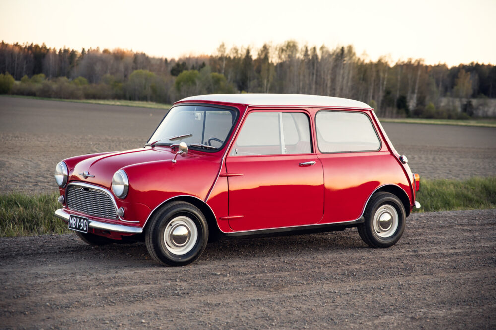 Red vintage Mini Cooper parked in countryside