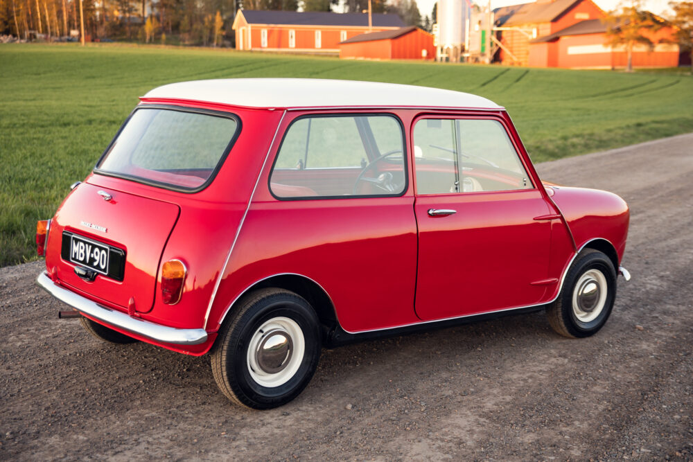 Red vintage Mini Cooper parked in countryside