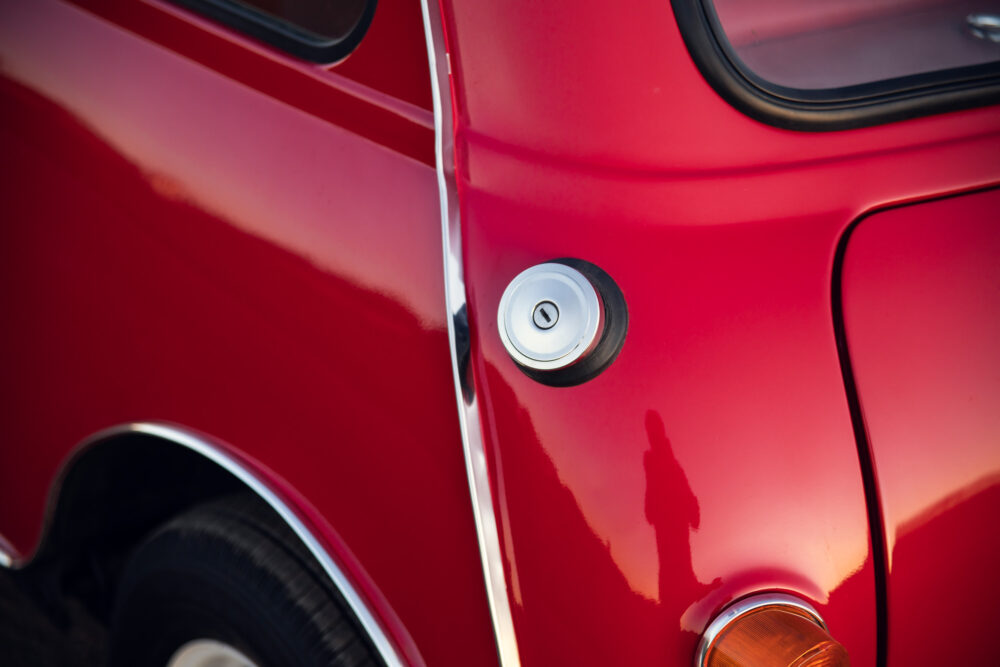 Red vintage car with chrome fuel cap
