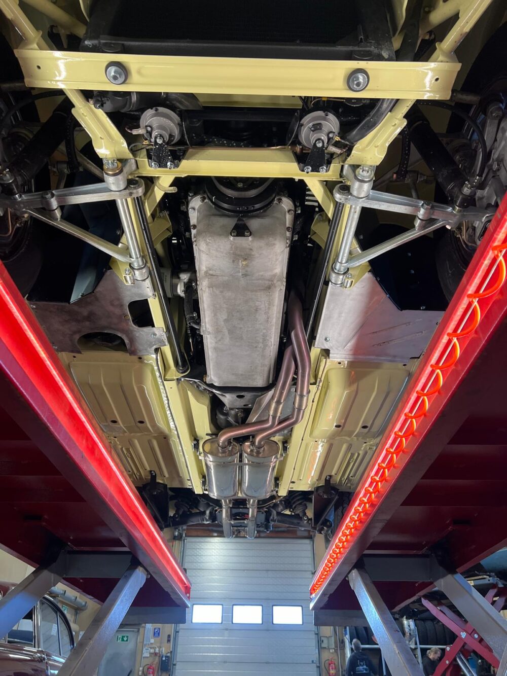 Undercarriage view of a vehicle on a lift