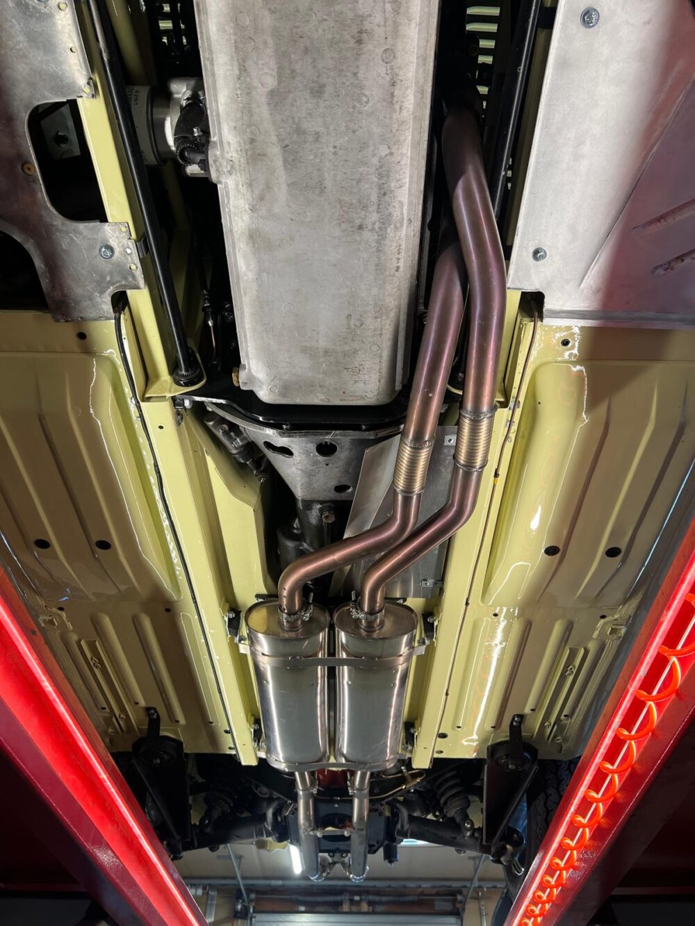 Undercarriage view of vehicle exhaust and suspension system